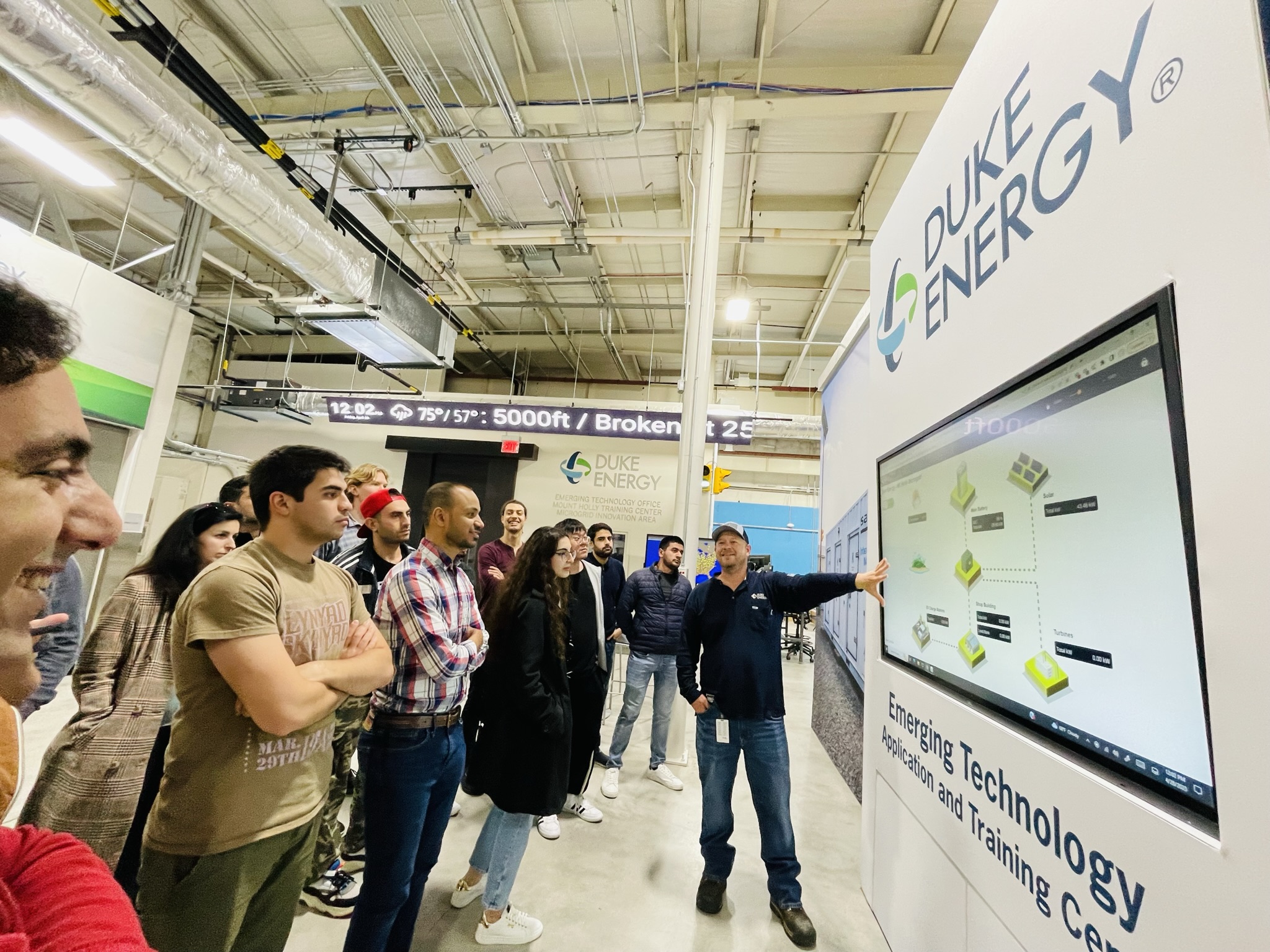Attendees watching a demonstration at Duke Energy Corporation