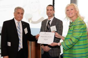 Professor Louri receiving his certificate