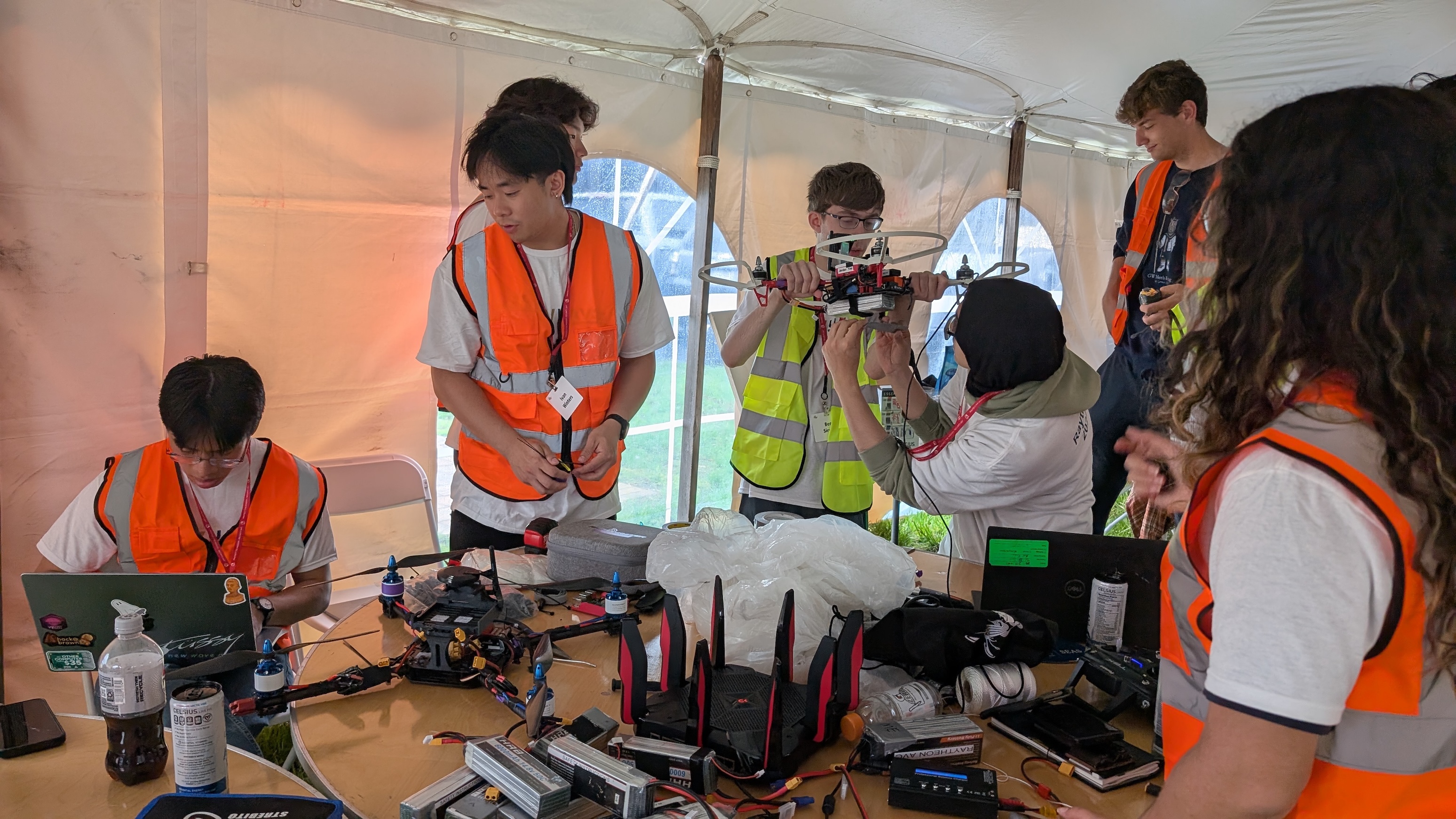 The team working on their drone at the competition 