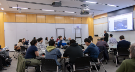 Participants listening to a presentation